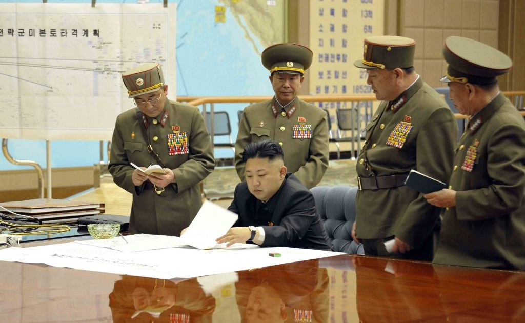 A picture released by the North Korean Central News Agency (KCNA) on 29 March 2013 shows North Korean leader Kim Jong-un (sitting) convening an urgent operation meeting at 0:30 am on 29 March 2013 at an undisclosed location, in which he ordered strategic rocket forces to be on standby to strike US and South Korean targets at any time. A picture released by the North Korean Central News Agency (KCNA) on 29 March 2013 shows North Korean leader Kim Jong-un (sitting) convening an urgent operation meeting at 0:30 am on 29 March 2013 at an undisclosed location, in which he ordered strategic rocket forces to be on standby to strike US and South Korean targets at any time.